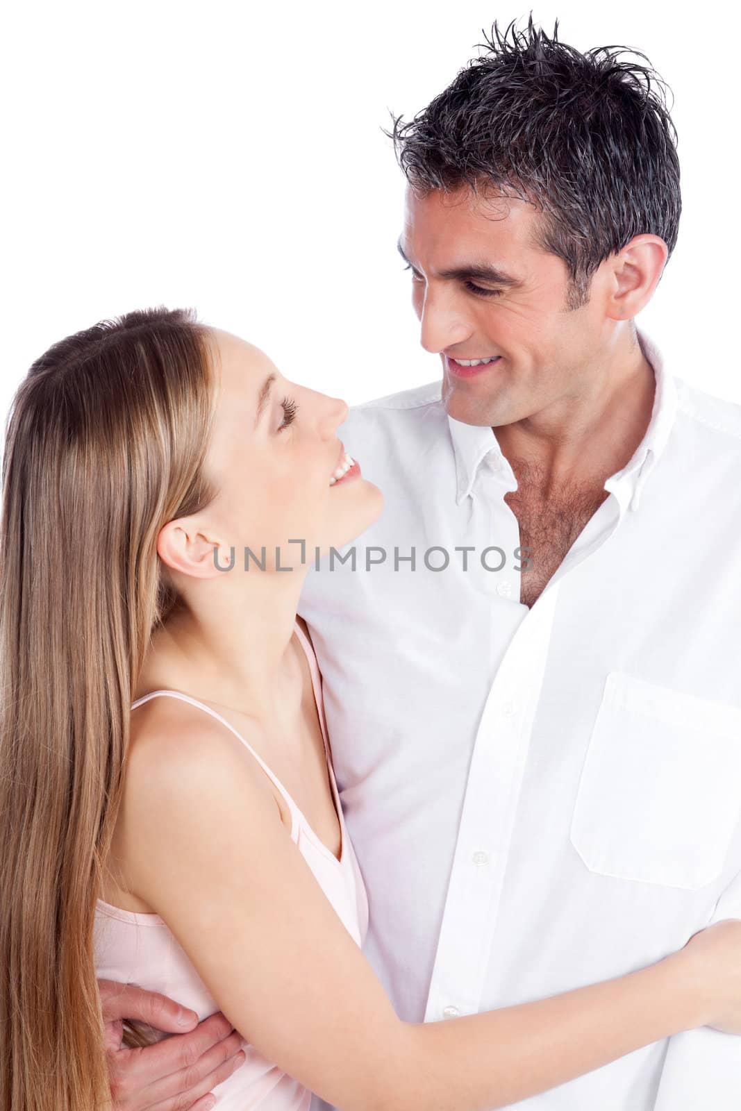 Portrait of young couple embracing isolated on white background.