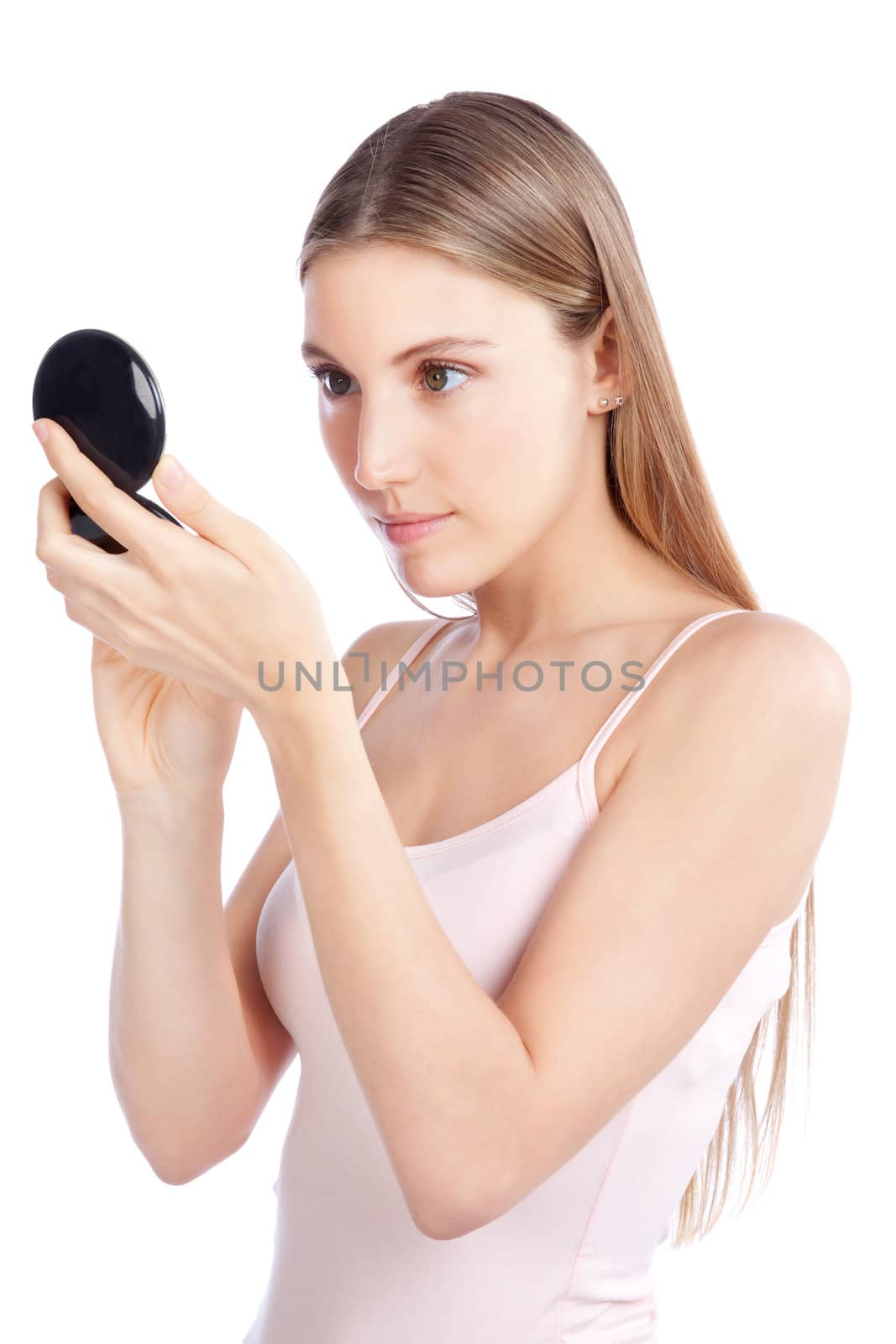 Beautiful woman checking herself with compact mirror.