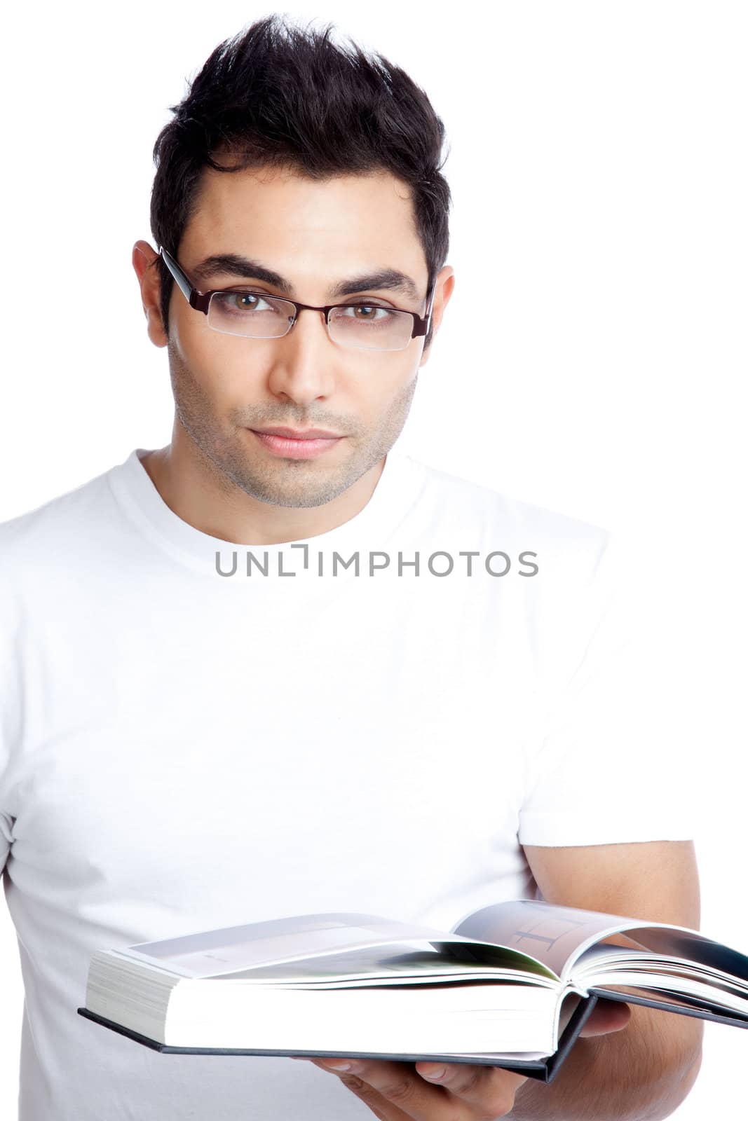 Portrait of confident young man with book in hand isolated on white background.