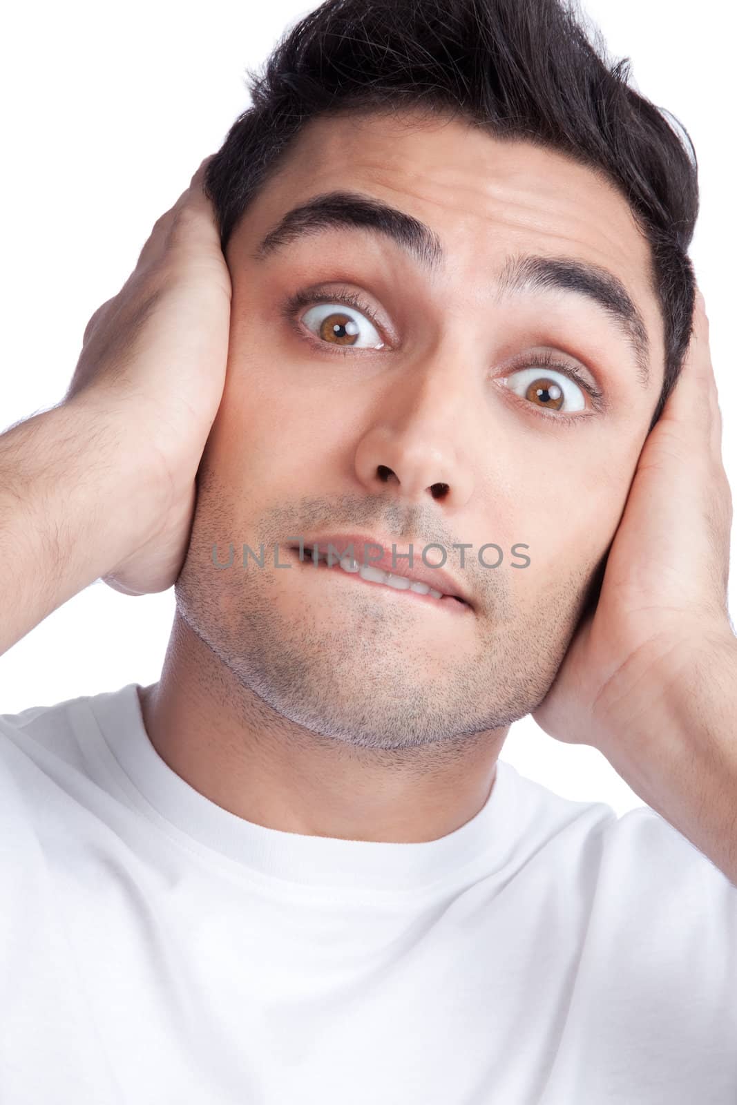 Young Asian man covering his ears isolated on white background.