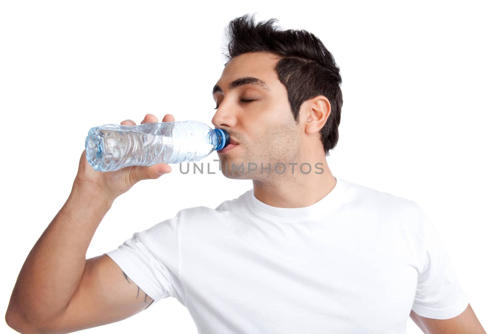 Portrait of young man drinking water from bottle isolated on white background.