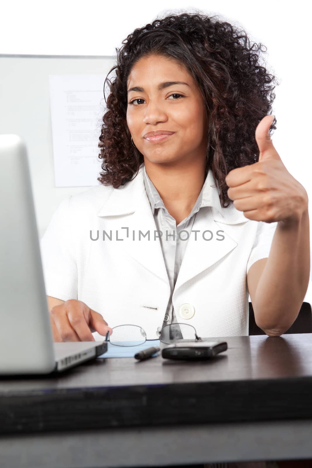 Portrait of female doctor giving thumb up at work isolated on white background.