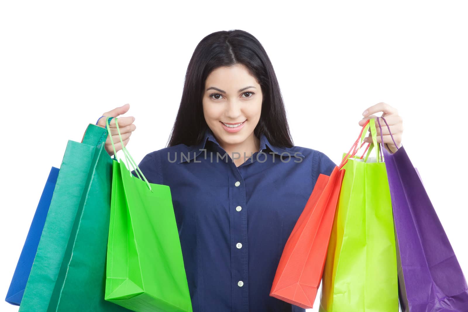 Close-up of happy young woman holding shopping bags isolated on white background.