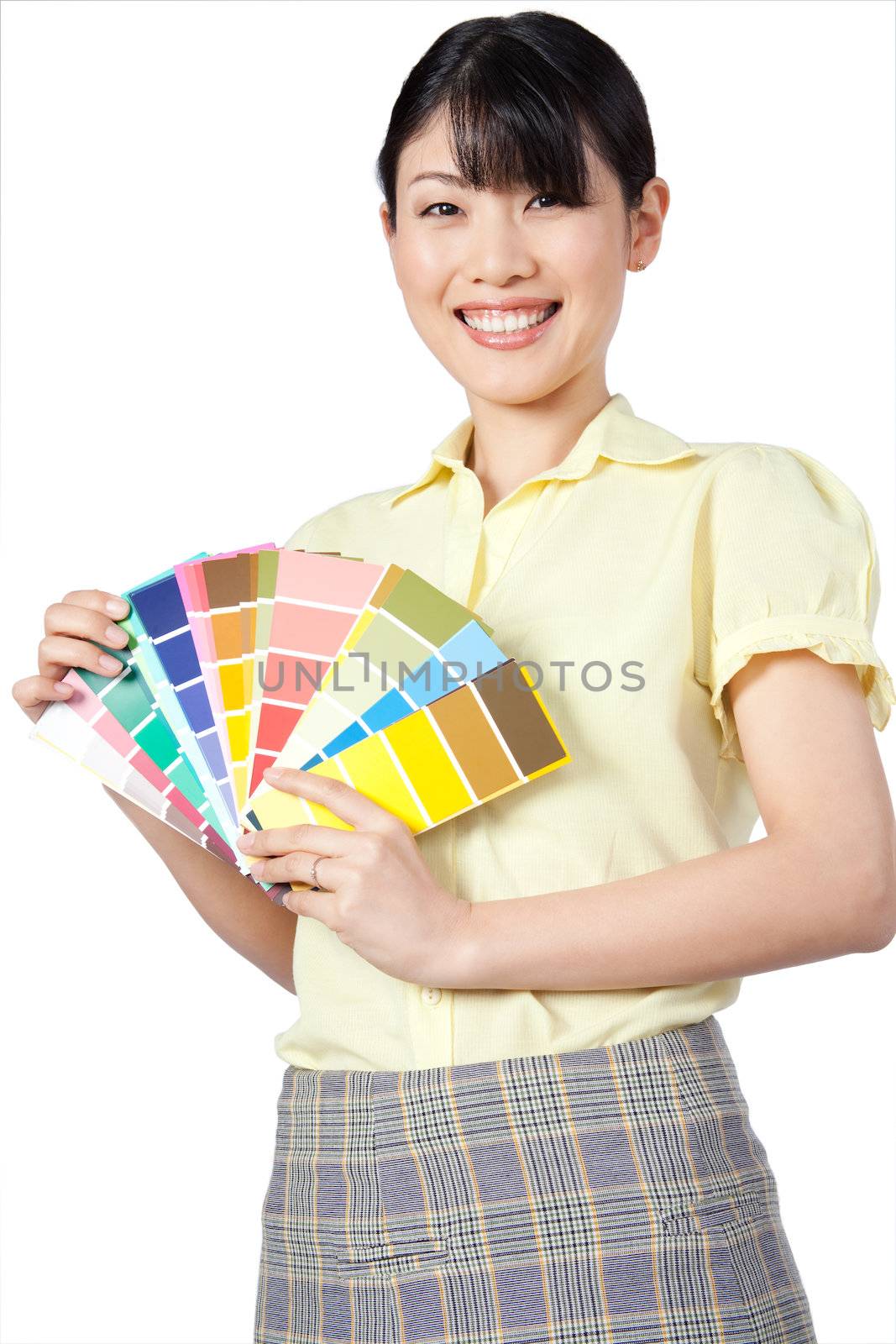 Happy young Asian woman showing color chart isolated on white background.