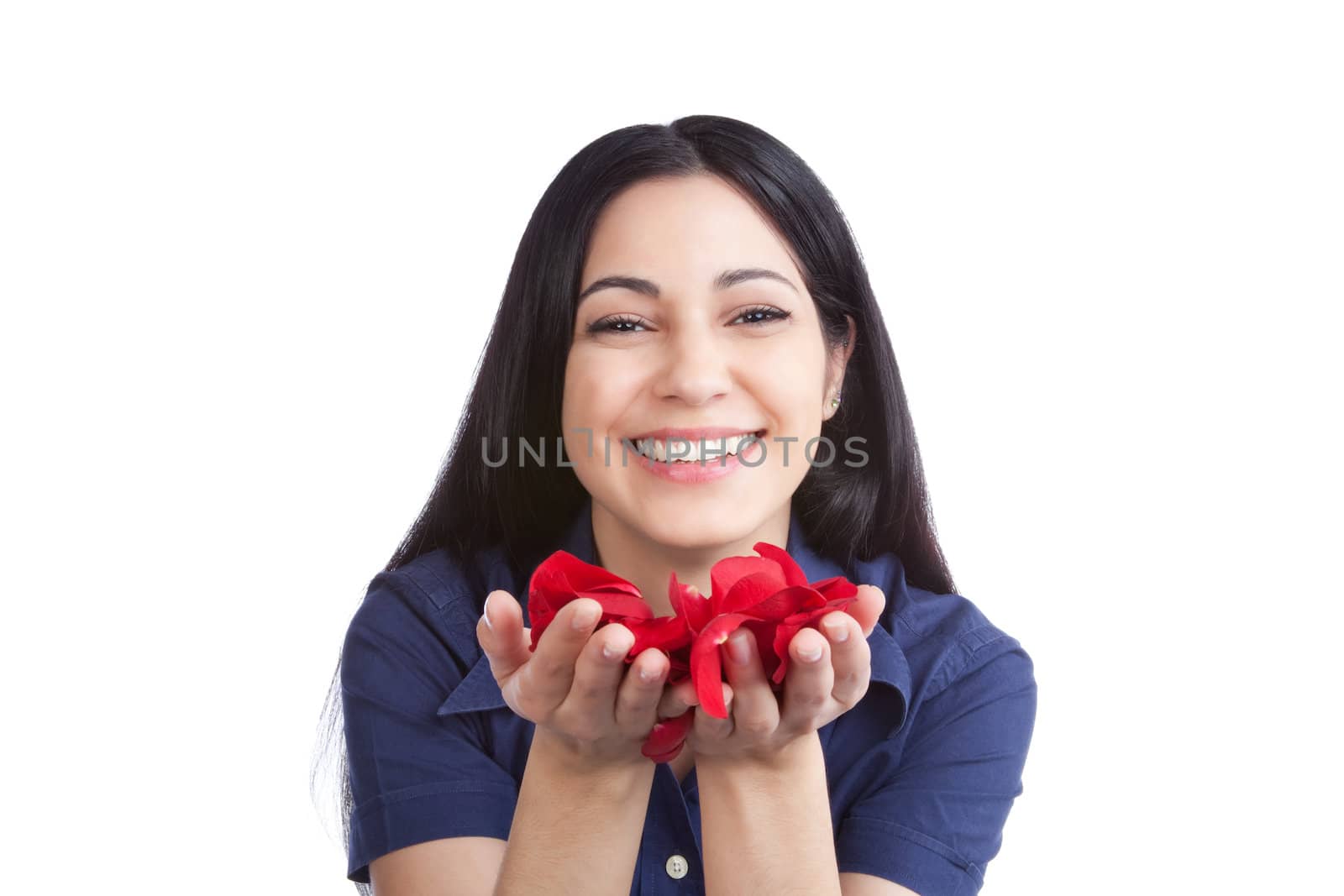 Happy young woman holding rose petals in hand isolated on white background.