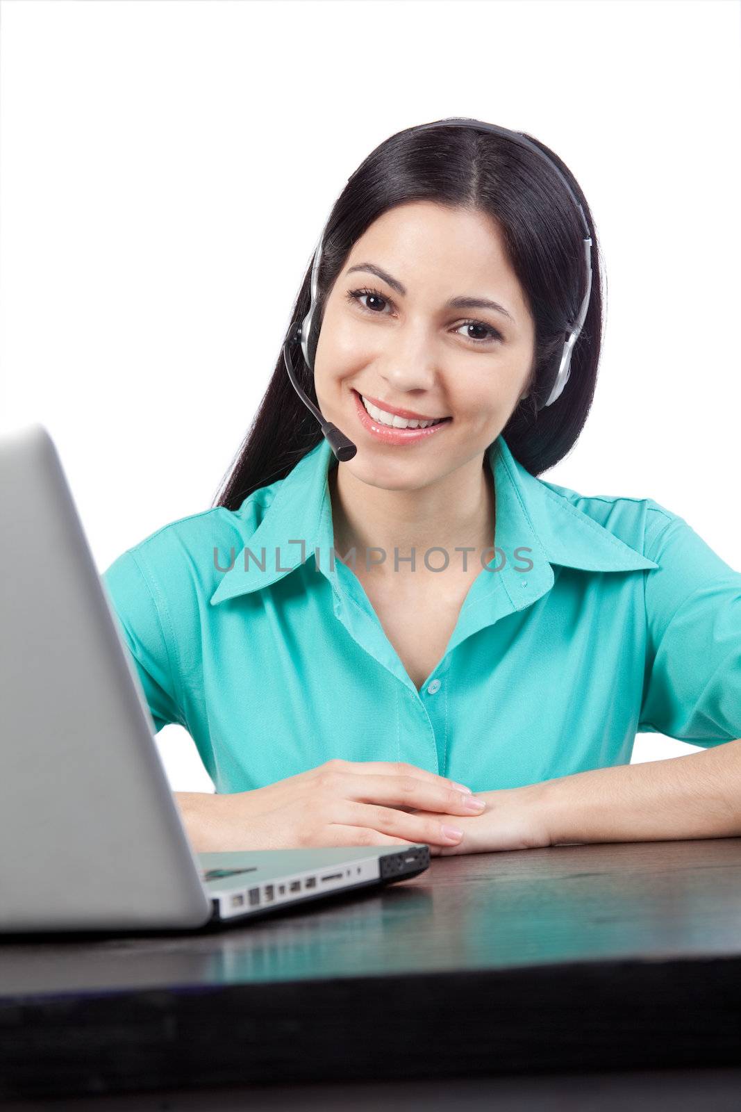 Happy businesswoman wearing a headset at work isolated on white background.