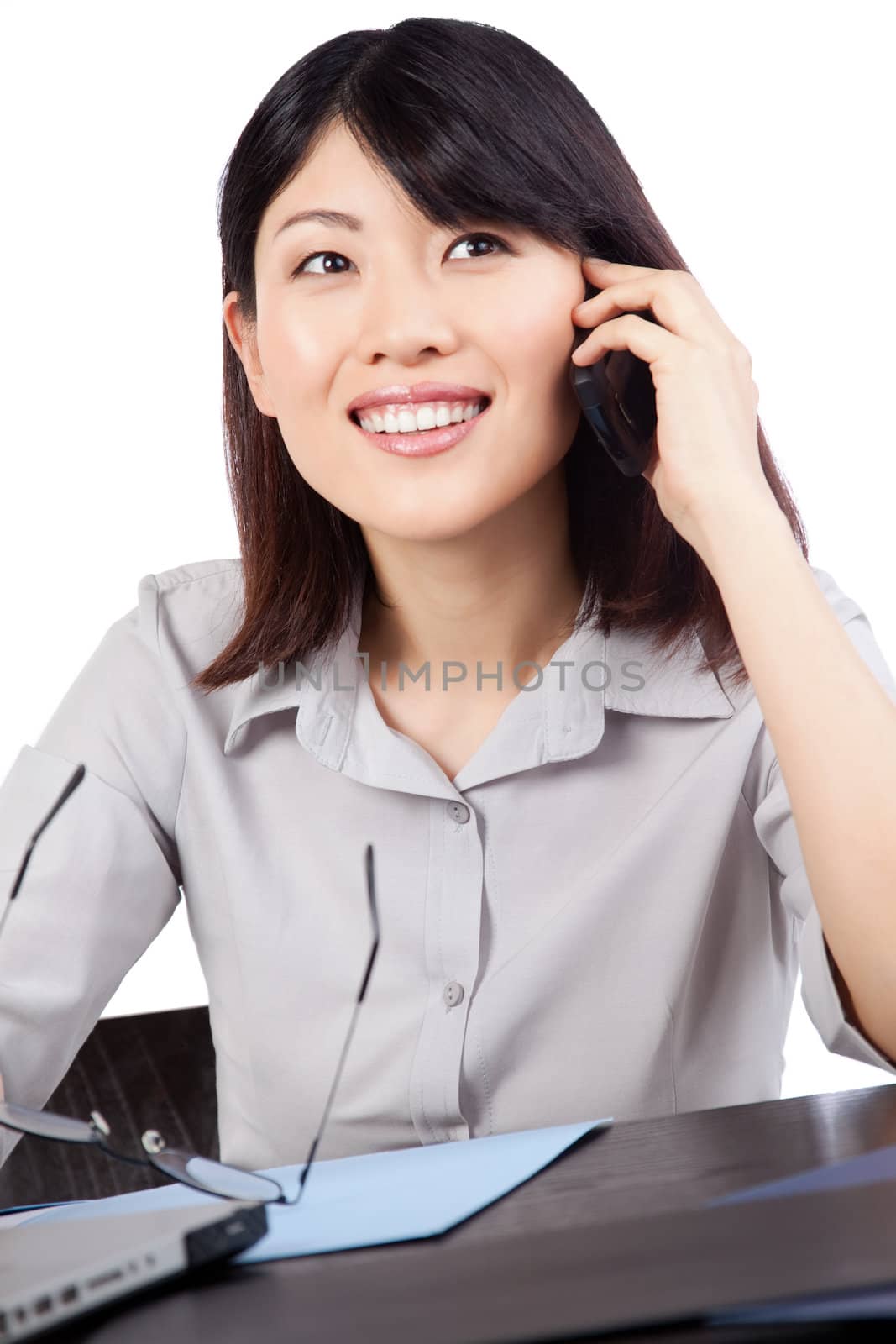 Businesswoman Talking on Cell Phone by leaf