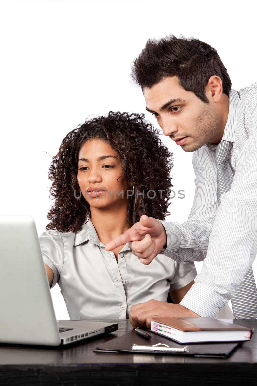 Businessman and businesswoman using laptop at work isolated on white background.