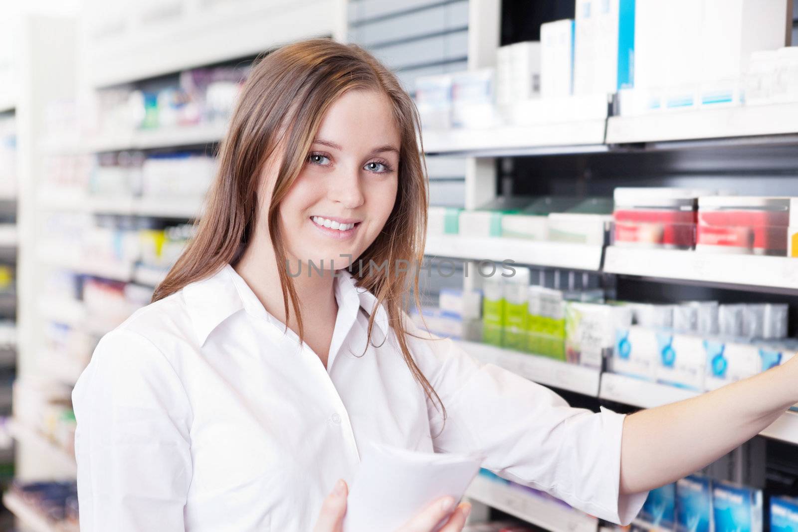 Pharmacist Working in Pharmacy Drugstore by leaf