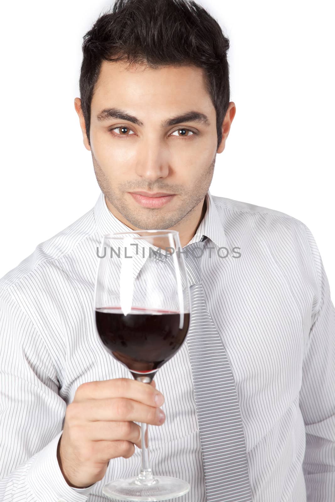 Happy young businessman holding red wine glass isolated on white background.
