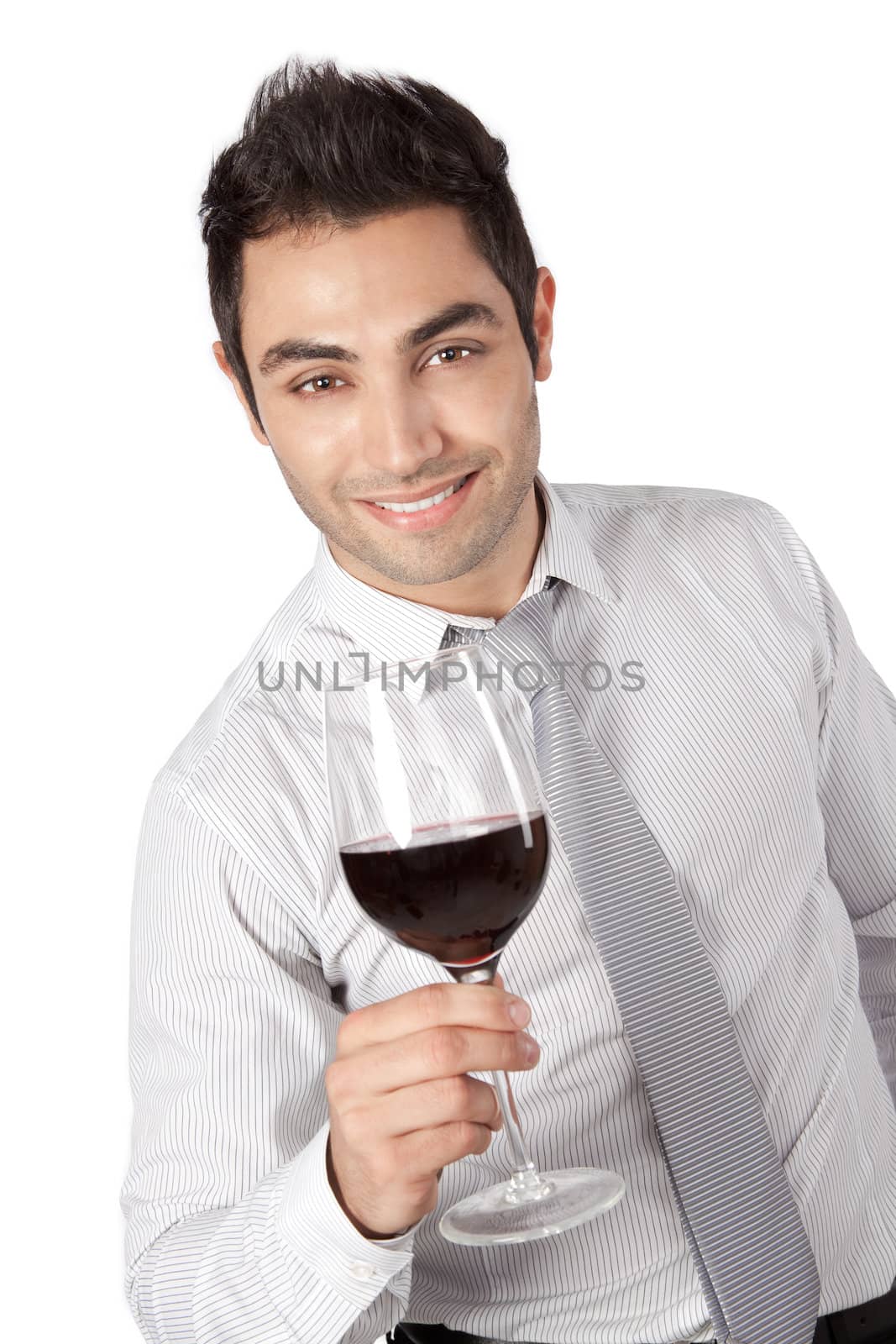 Young businessman holding red wine glass isolated on white background.