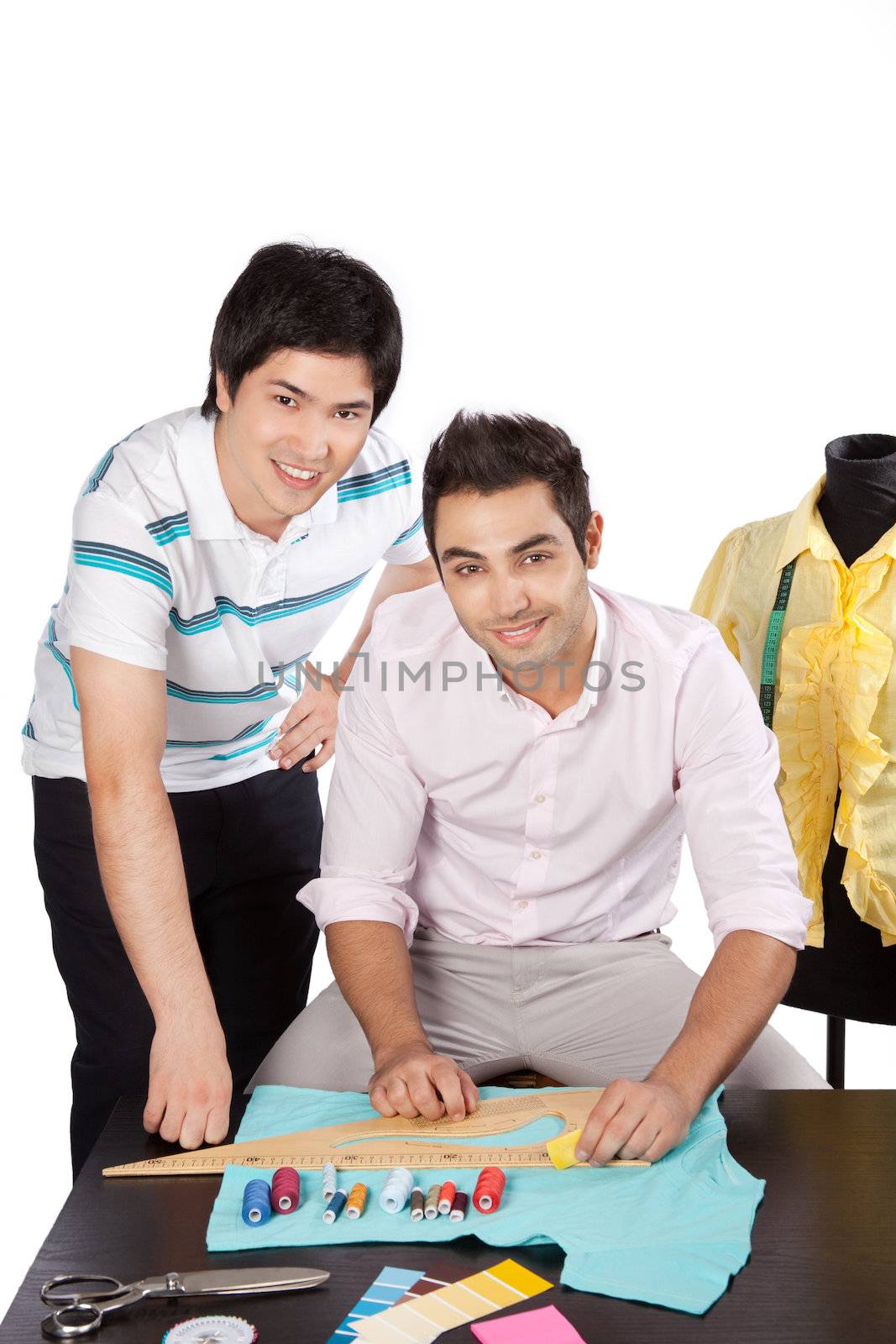 Two young woman dressmaker at work.