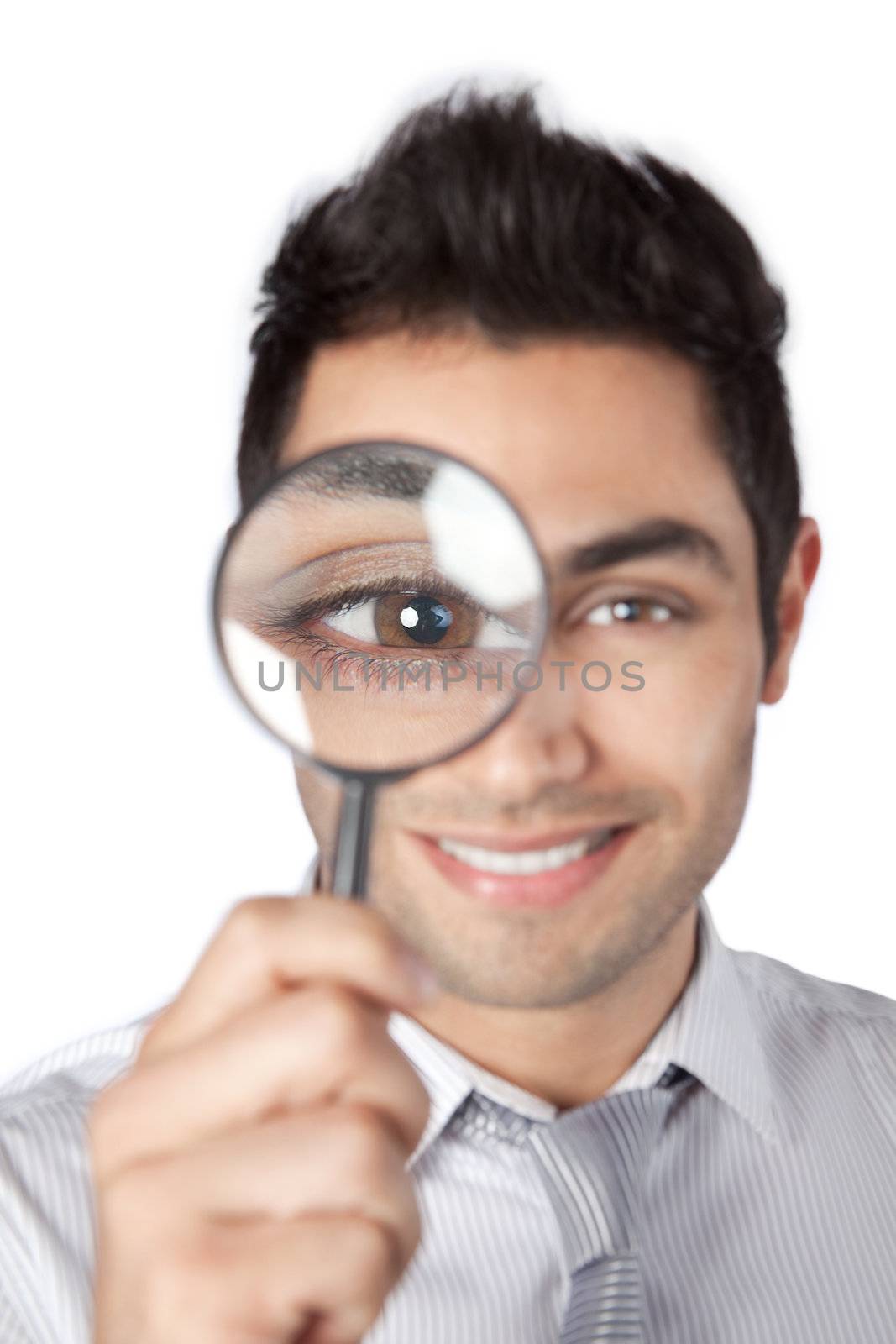 Businessman Holding Magnifying Glass by leaf