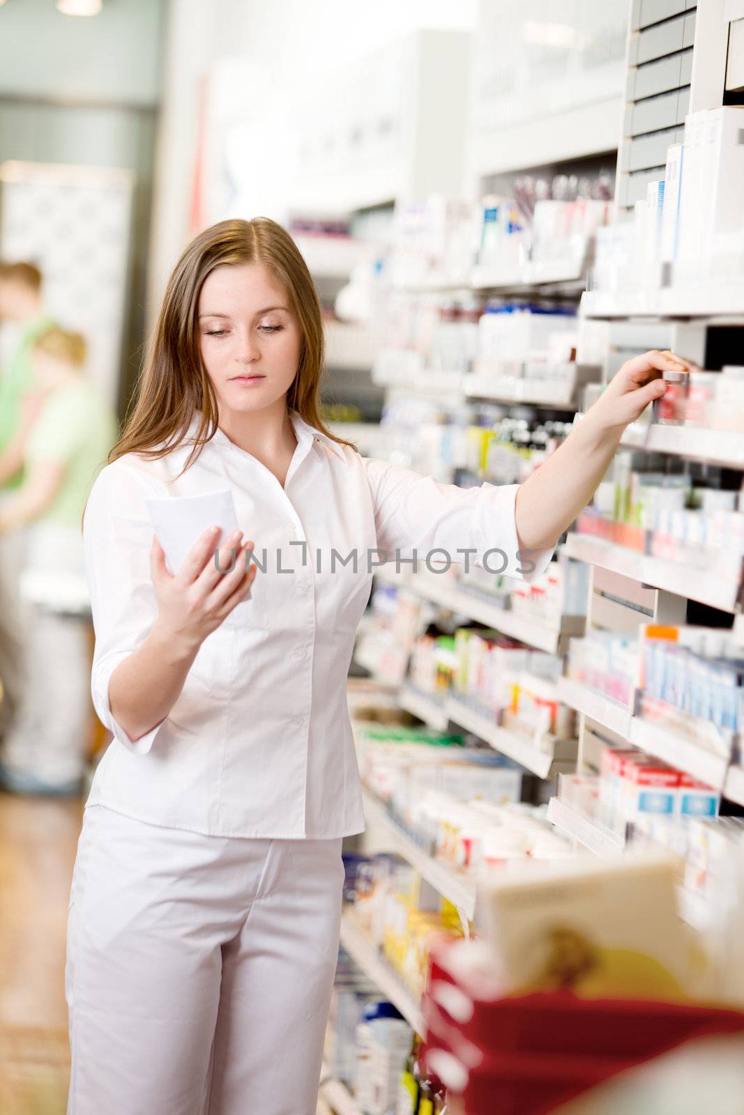 Pharmacist Looking at Prescription by leaf