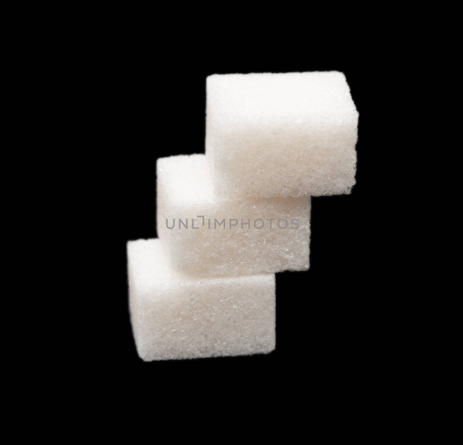 three lumps of sugar on a black background by schankz