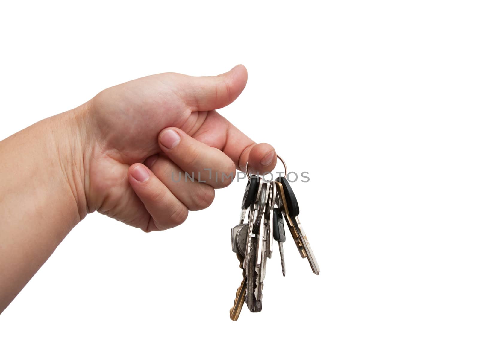 Old rusty bunch of keys in hand. Isolated on white 