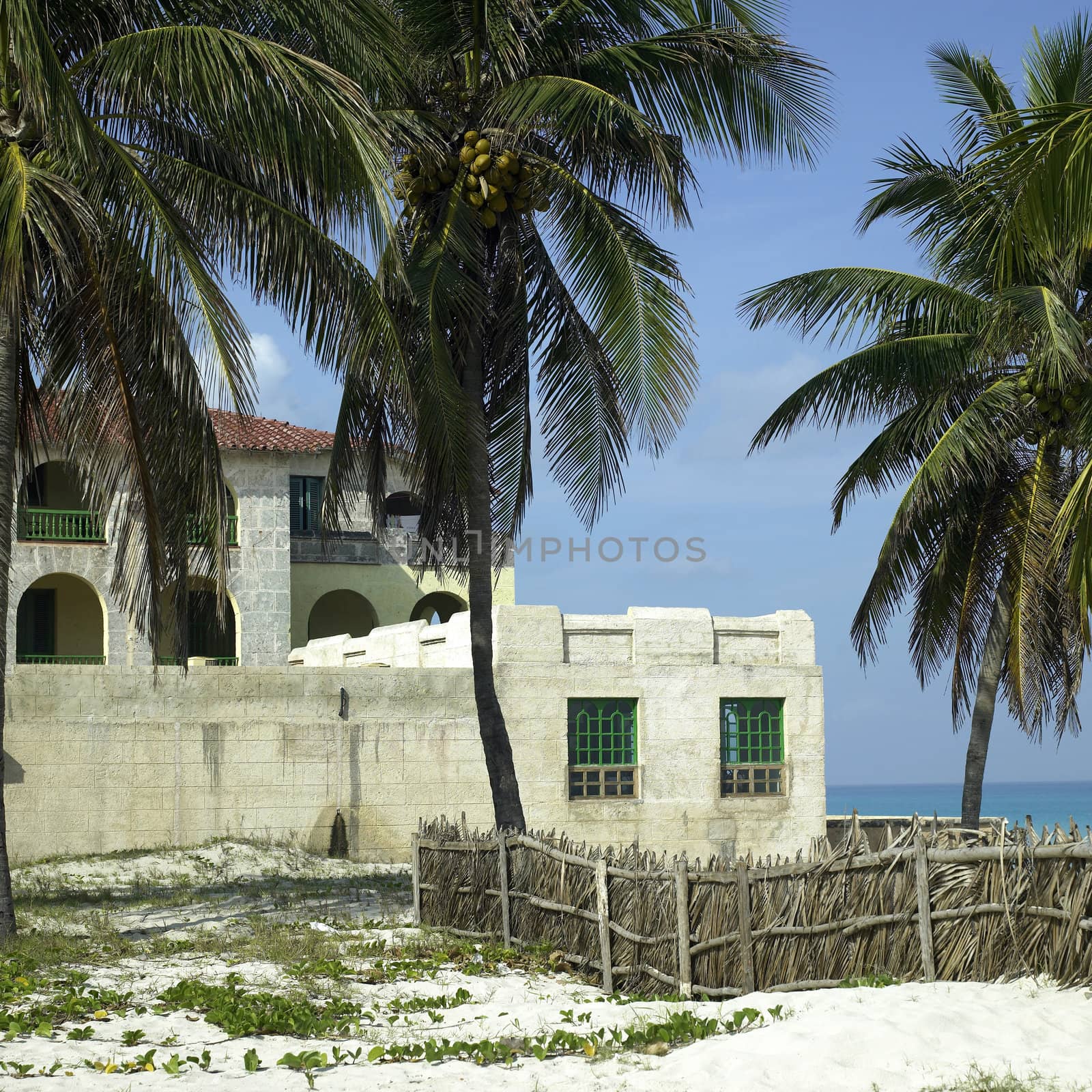 Old tropical villa made of stone blocks
