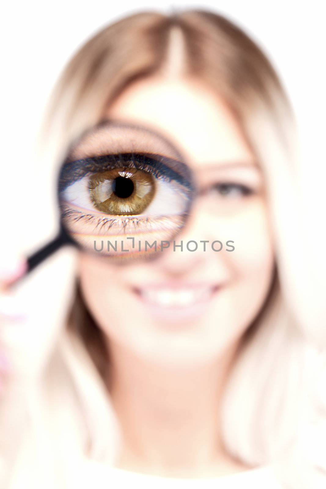 attractive caucasian girl with loupe on her eye