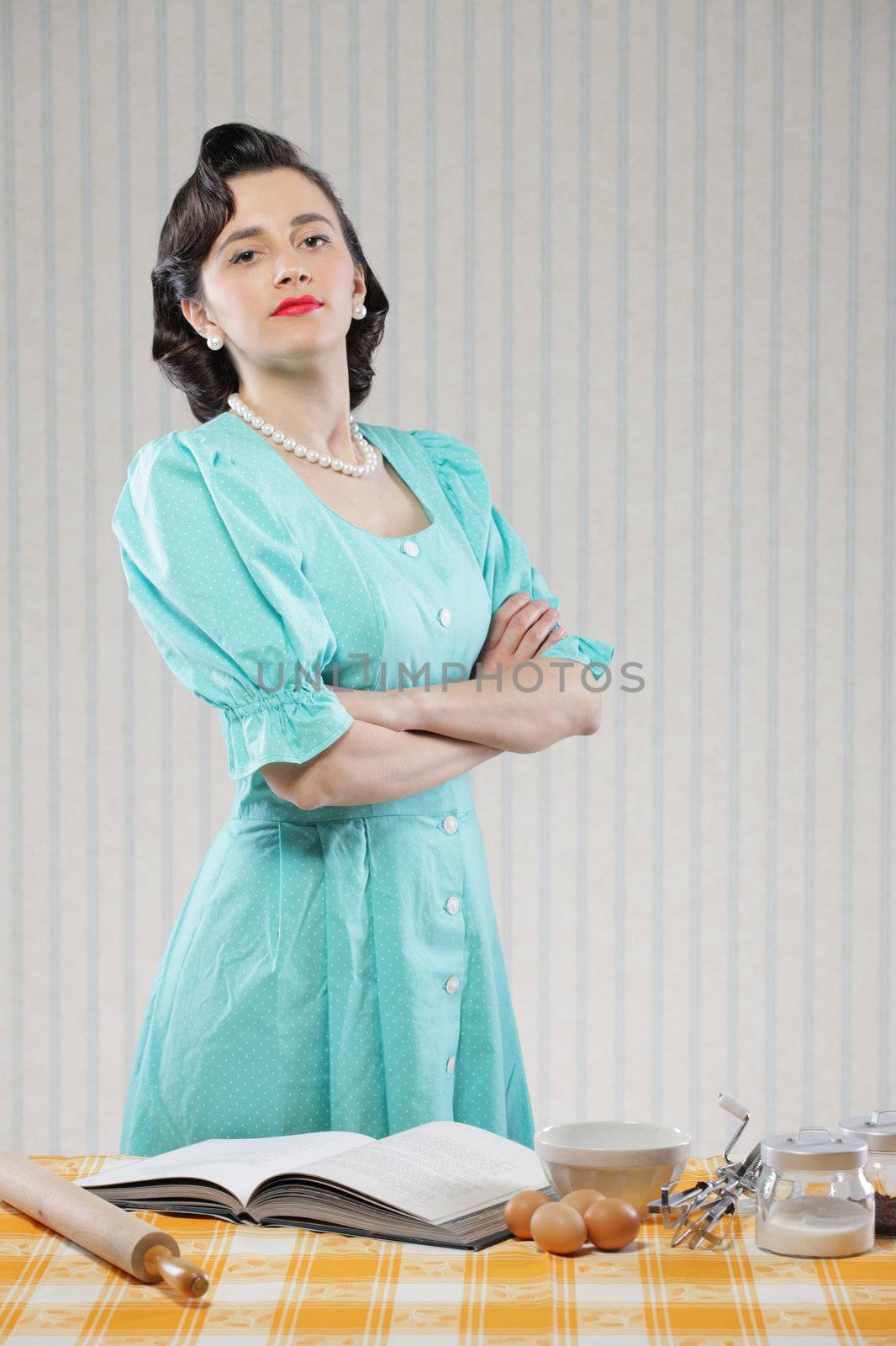 Vintage portrait of a housewife in the kitchen