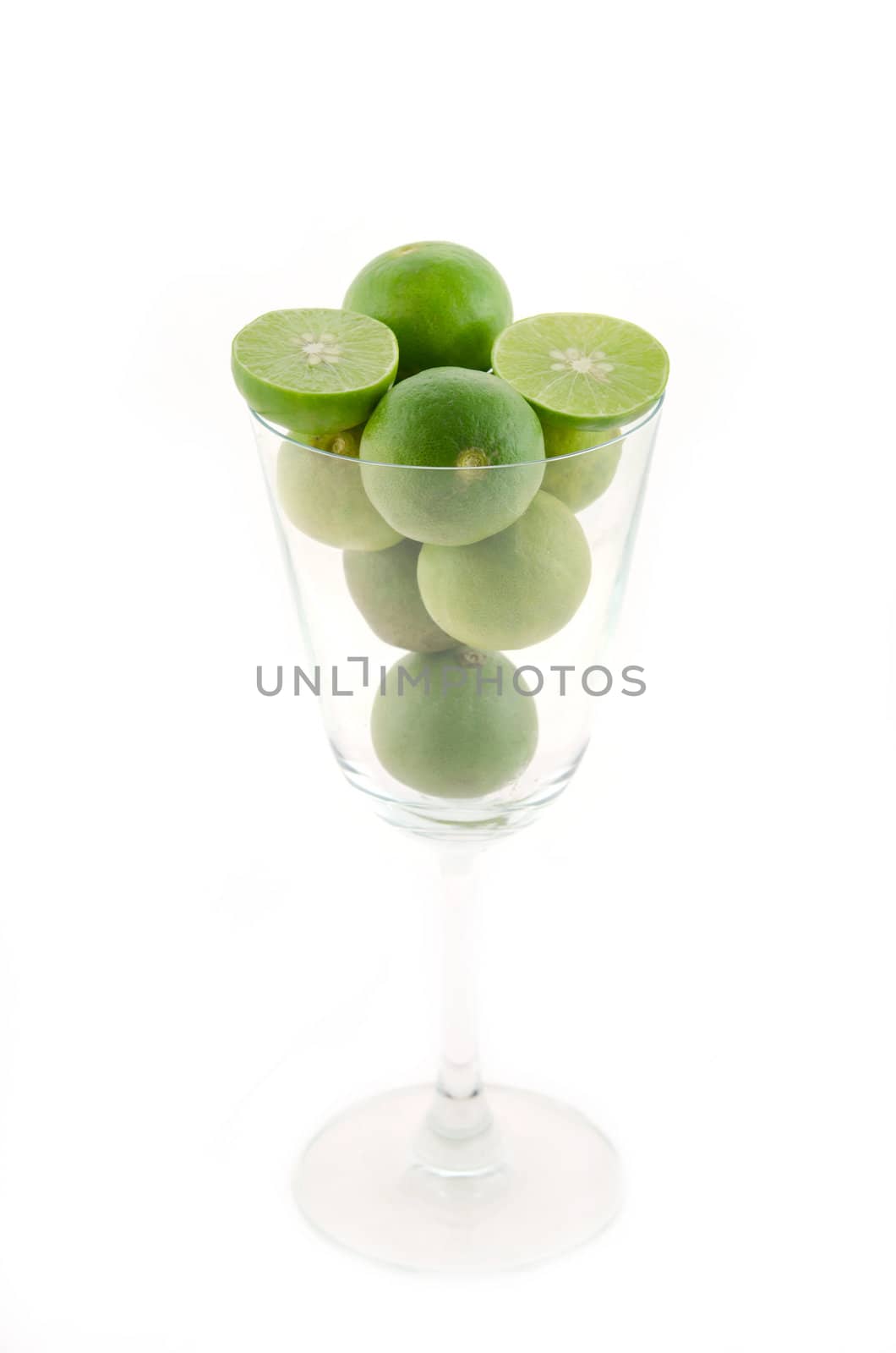 Fresh lime and slice in glass  on white background