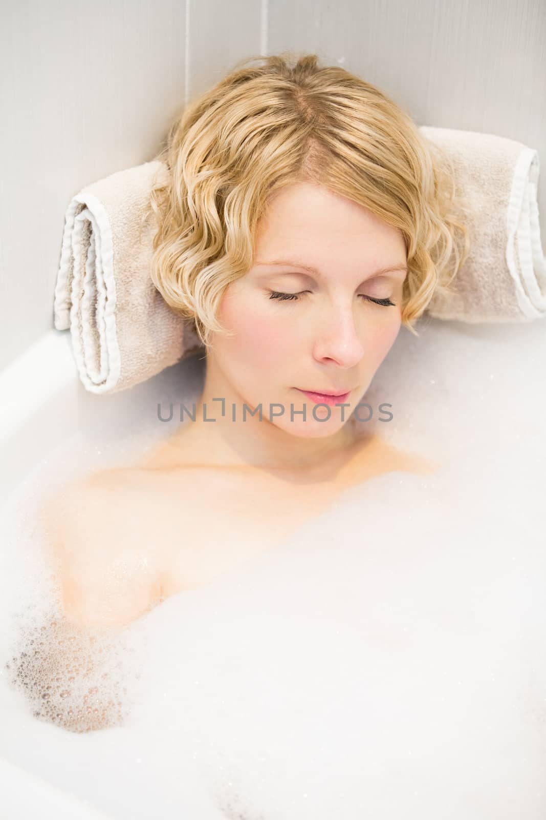 Young woman sleeping in the bath by aetb