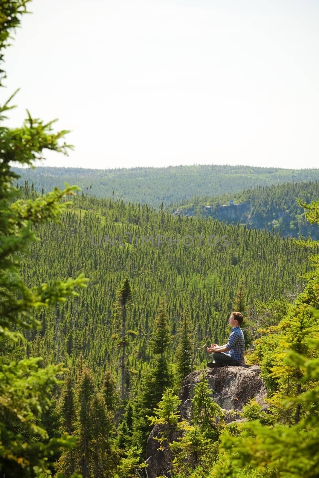 Yoga on a rock in the middle of the nature