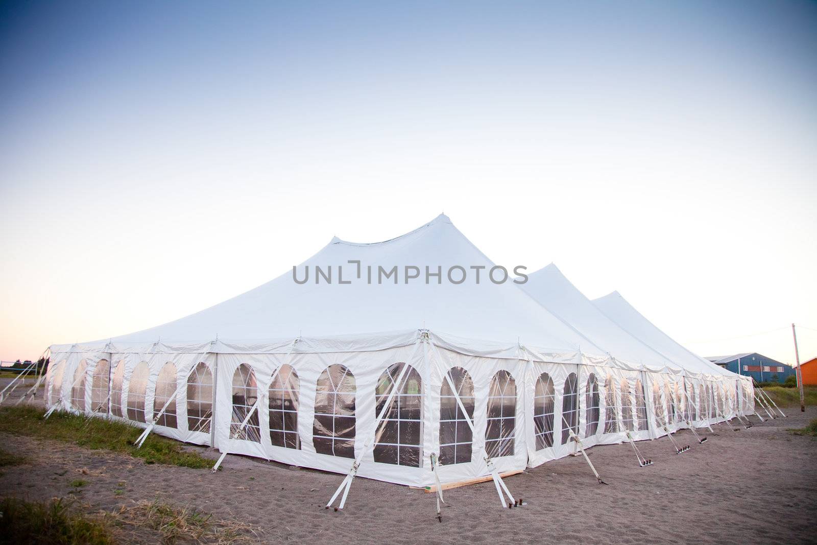 Party or event white tent during the evening