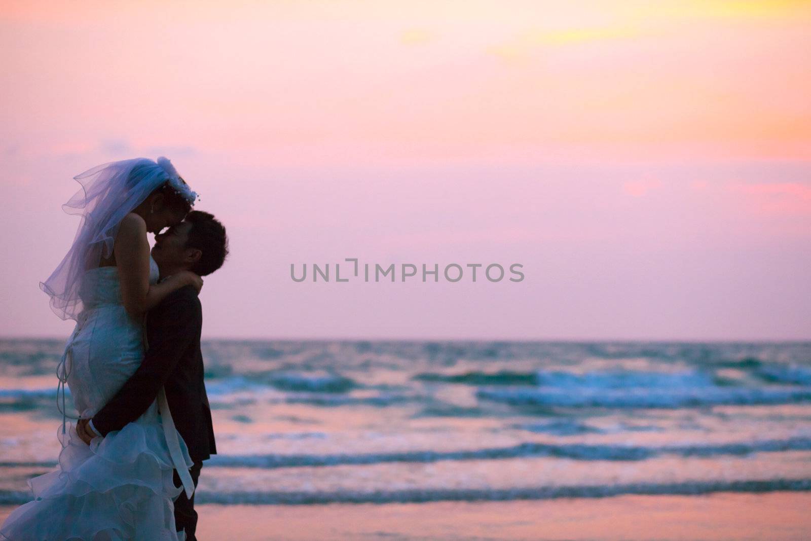 Couples Wedding beach sunset by vichie81