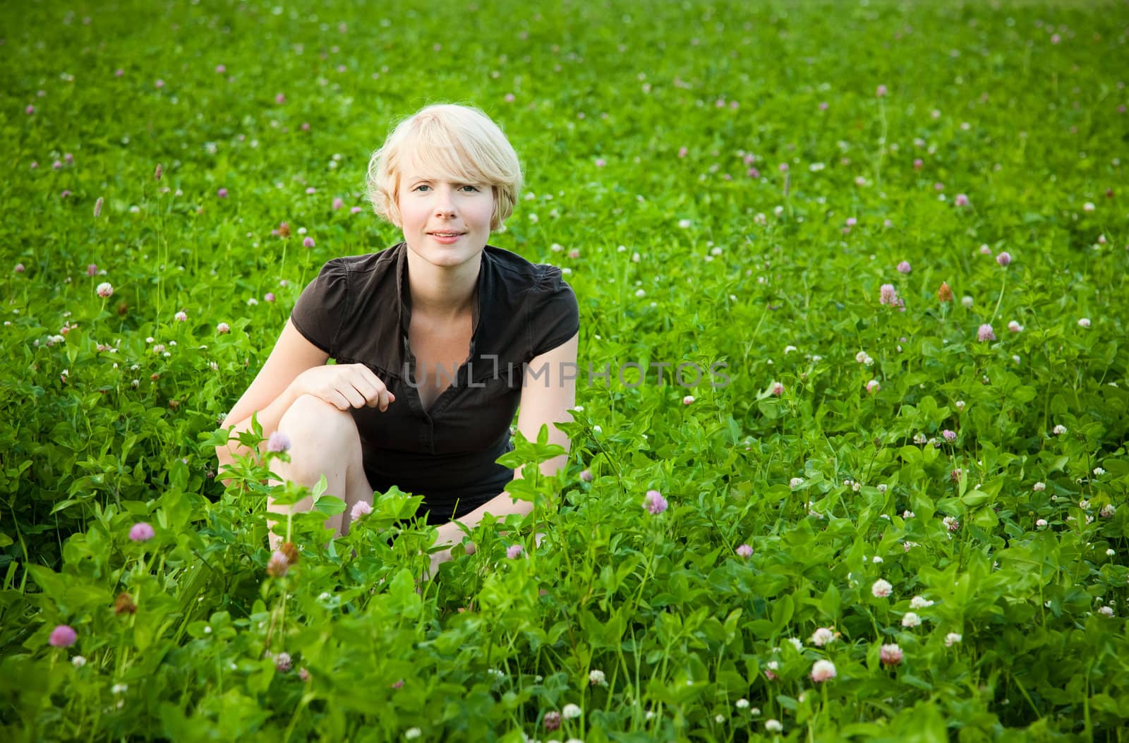 Girl in a field of flowers posing