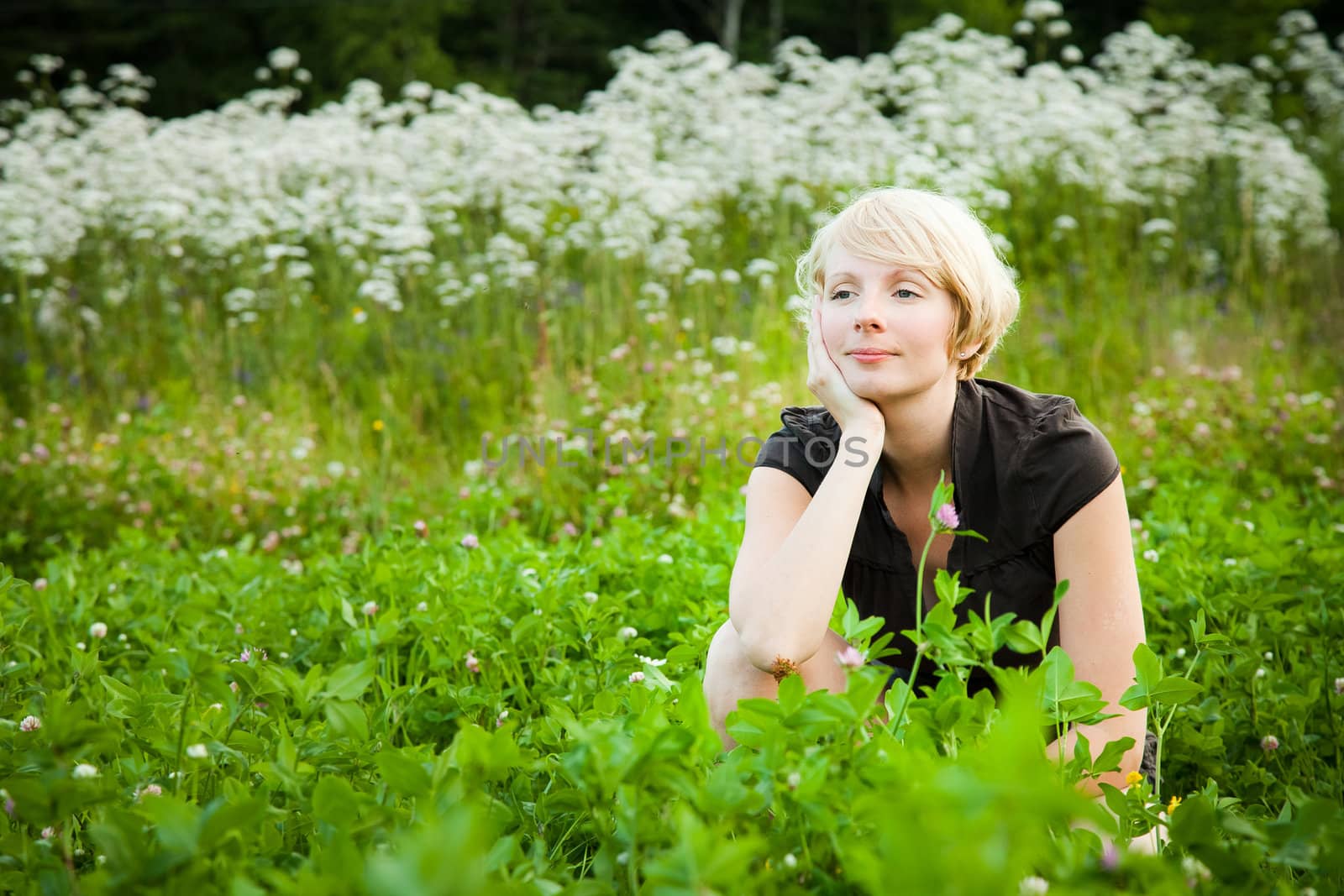 Girl in a field of white flowers