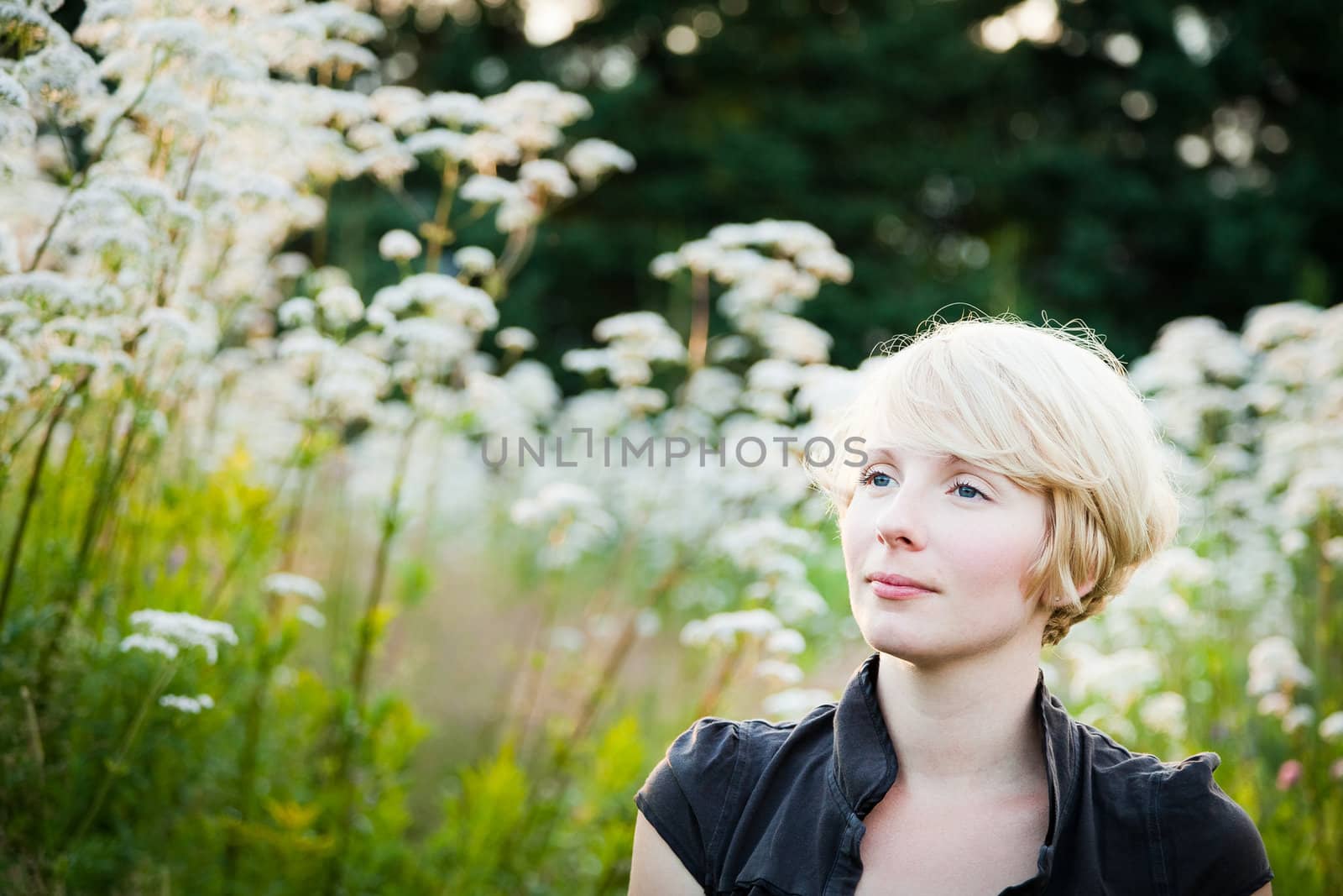 Girl in a field of white flowers