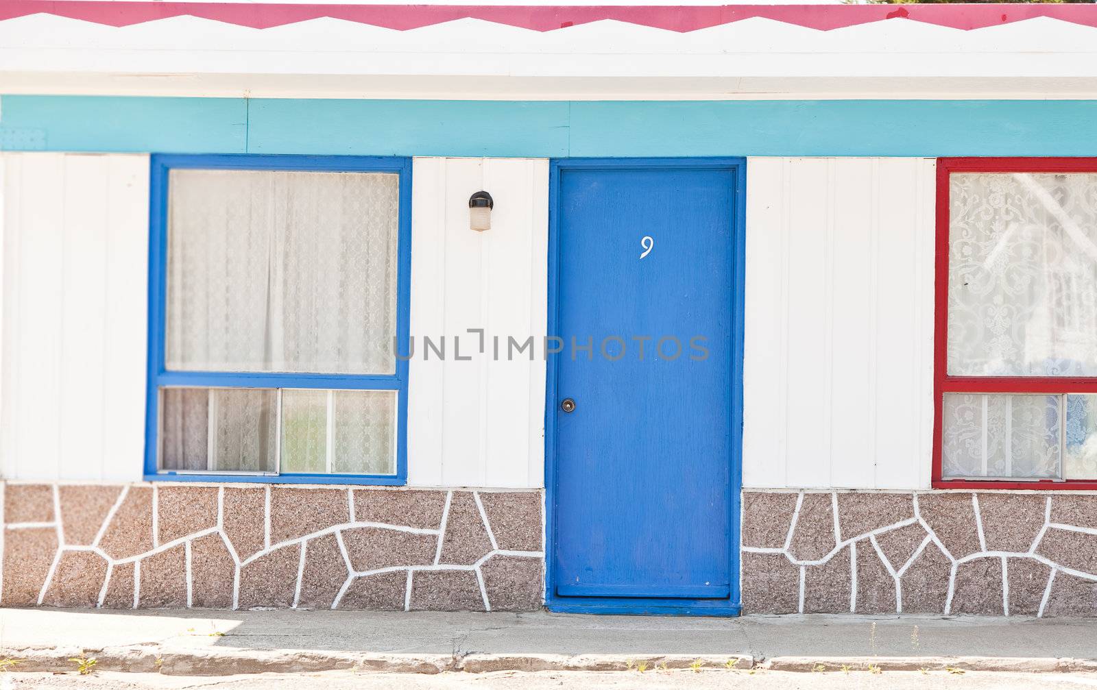 Motel with red and blue doors