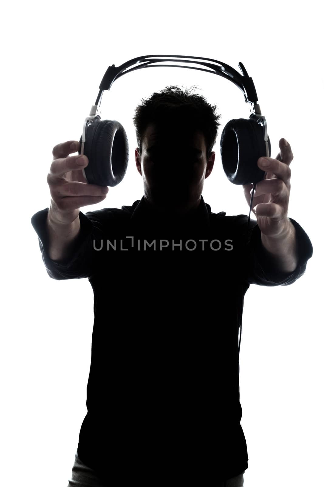 Male in silhouette showing headphones isolated on white background