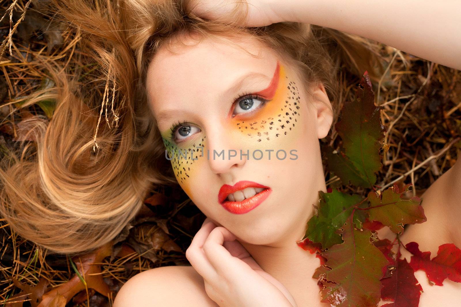 Happy teenager in a forest in the autumn