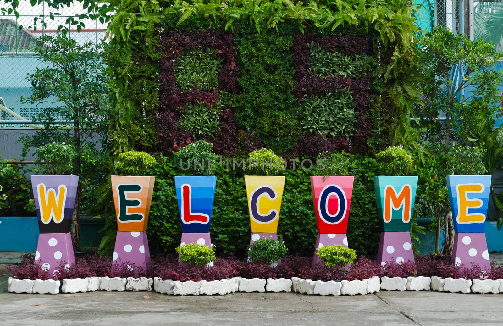 welcome sign word on flower pots by hinnamsaisuy