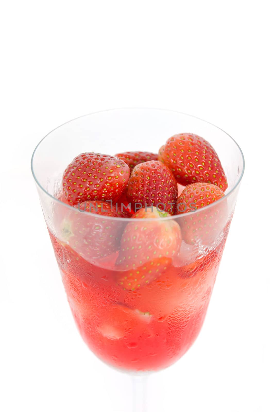 close up ice strawberry juice in glass over white