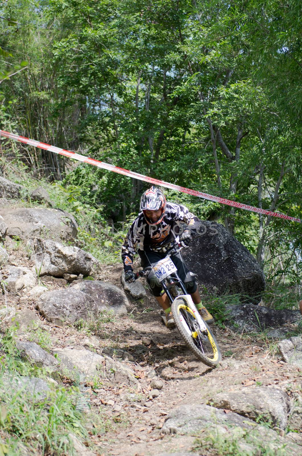 Hua Hin,Thailand - December 1st : Unidentified bicycle racing downhill competitors during the "Hua Hin mountain bike racing 2012  " at Hinlekfai mountain on December 1st, 2012 in Hua Hin,Thailand. 