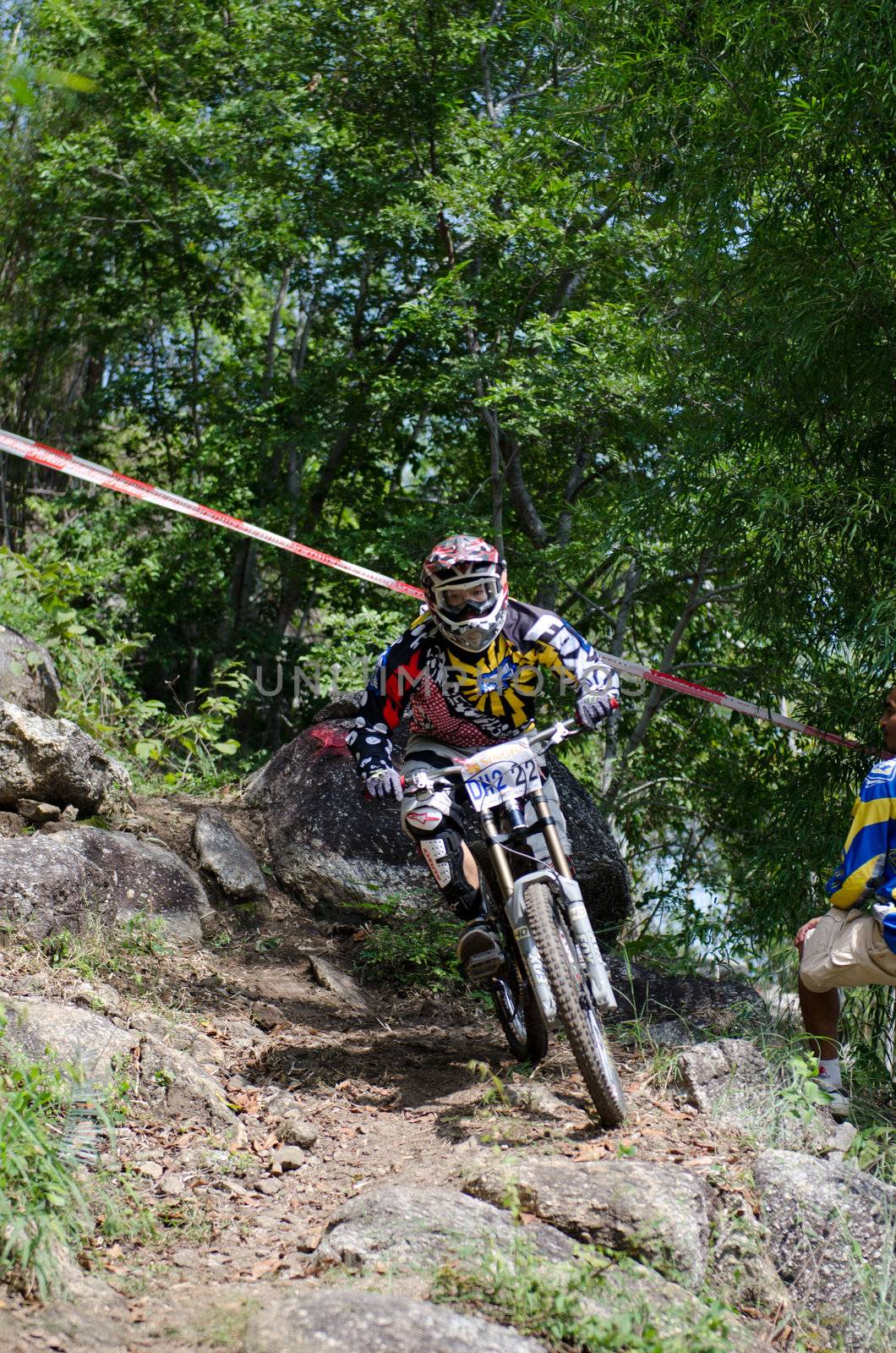 Hua Hin,Thailand - December 1st : Unidentified bicycle racing downhill competitors during the "Hua Hin mountain bike racing 2012  " at Hinlekfai mountain on December 1st, 2012 in Hua Hin,Thailand. 