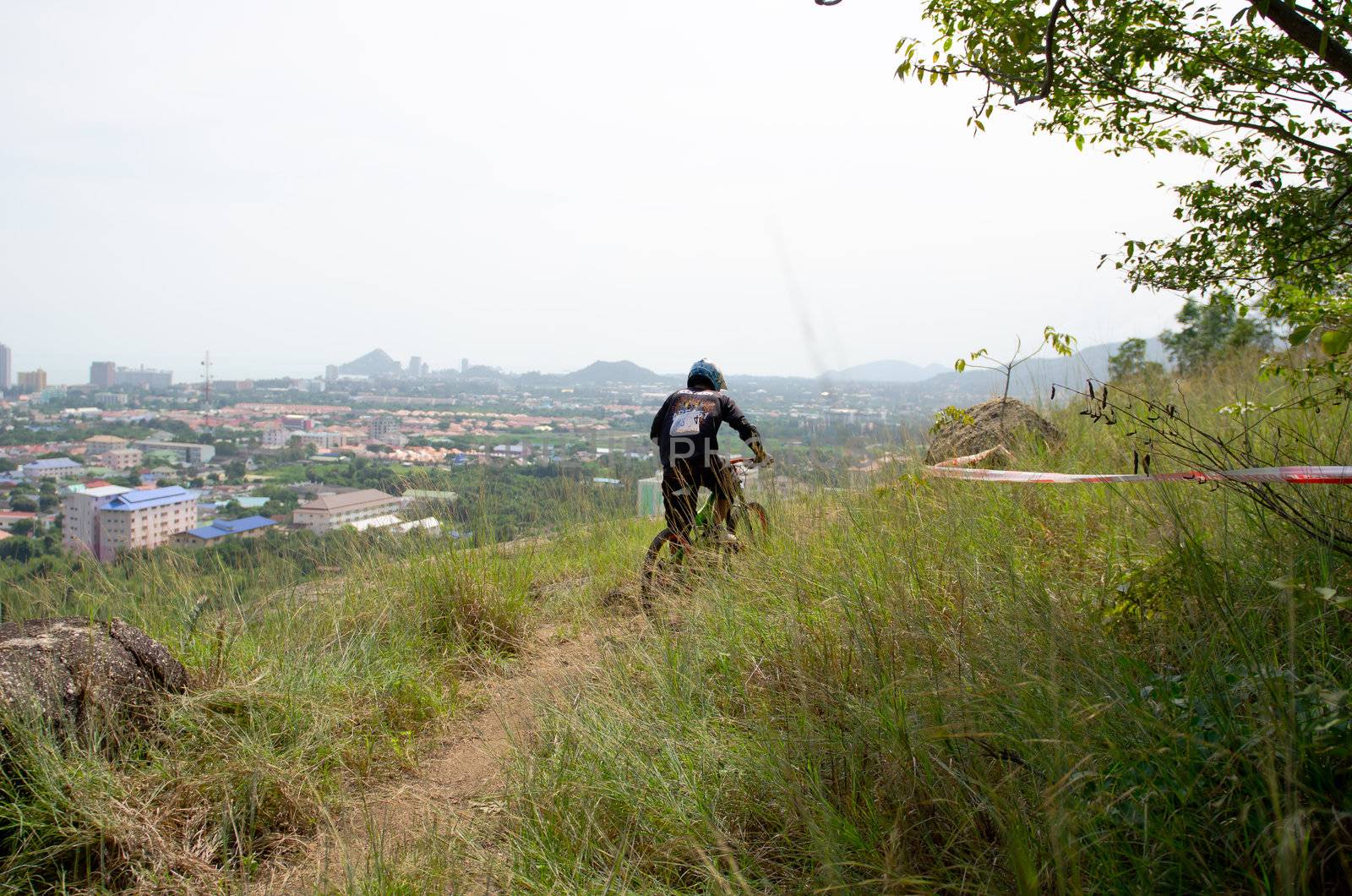 Hua Hin,Thailand - December 1st : Unidentified bicycle racing downhill competitors during the "Hua Hin mountain bike racing 2012  " at Hinlekfai mountain on December 1st, 2012 in Hua Hin,Thailand. 