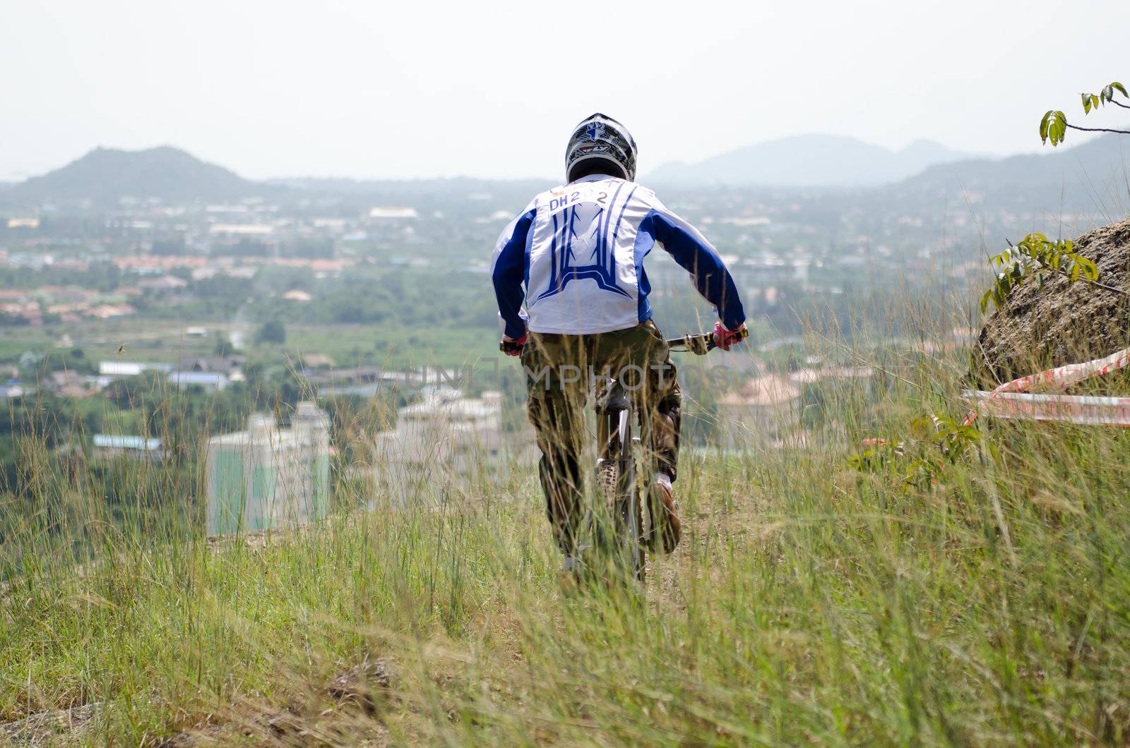 Hua Hin,Thailand - December 1st : Unidentified bicycle racing downhill competitors during the "Hua Hin mountain bike racing 2012  " at Hinlekfai mountain on December 1st, 2012 in Hua Hin,Thailand. 