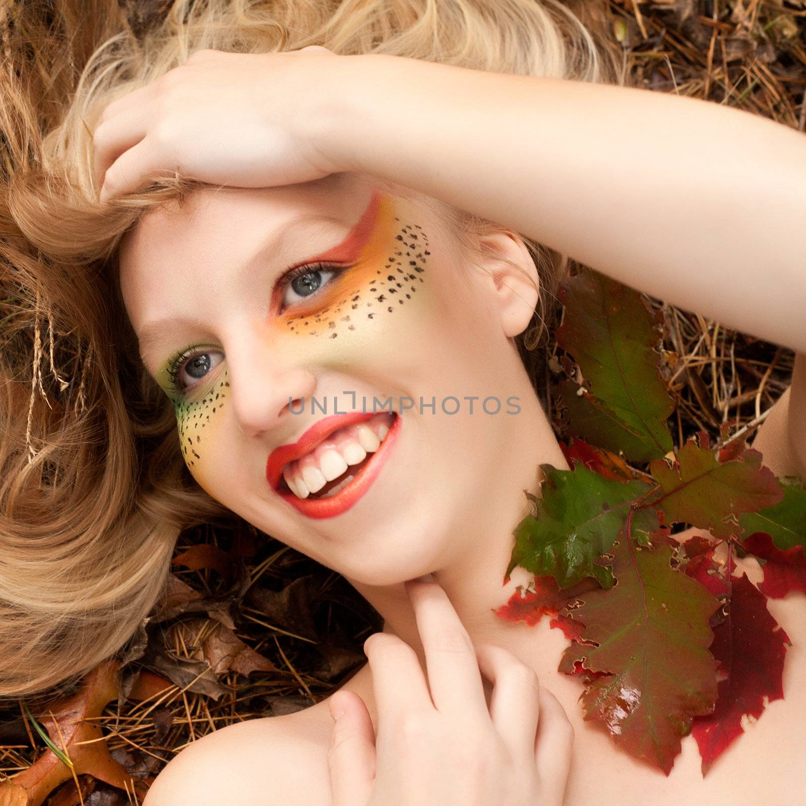 Happy teenager in a forest in the autumn