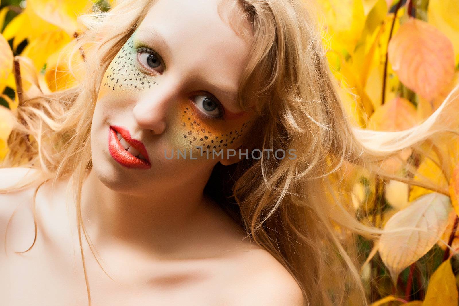 Happy teenager in a forest in the autumn