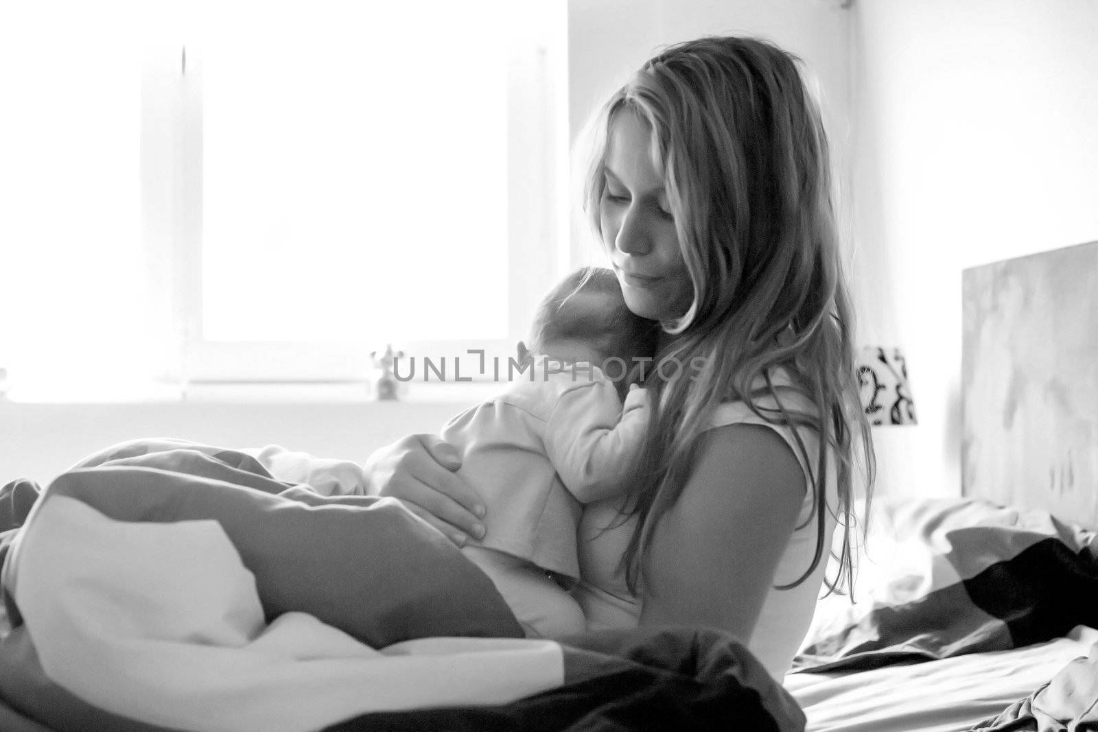 Baby is sleeping om mothers arms in black and white by DNFStyle