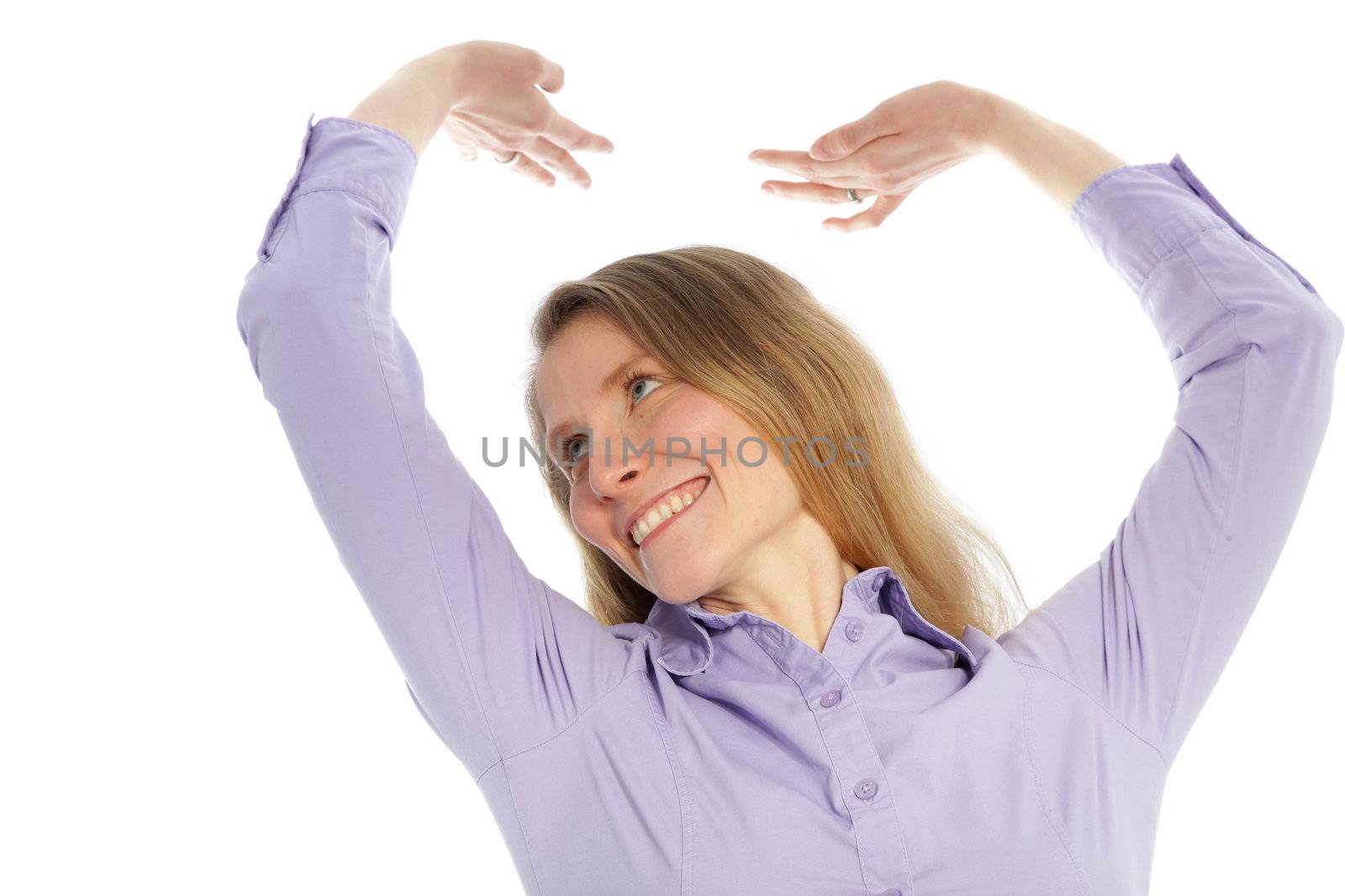 Smiling woman stretching raising her arms above her head as she relaxes and unwinds isolated on white