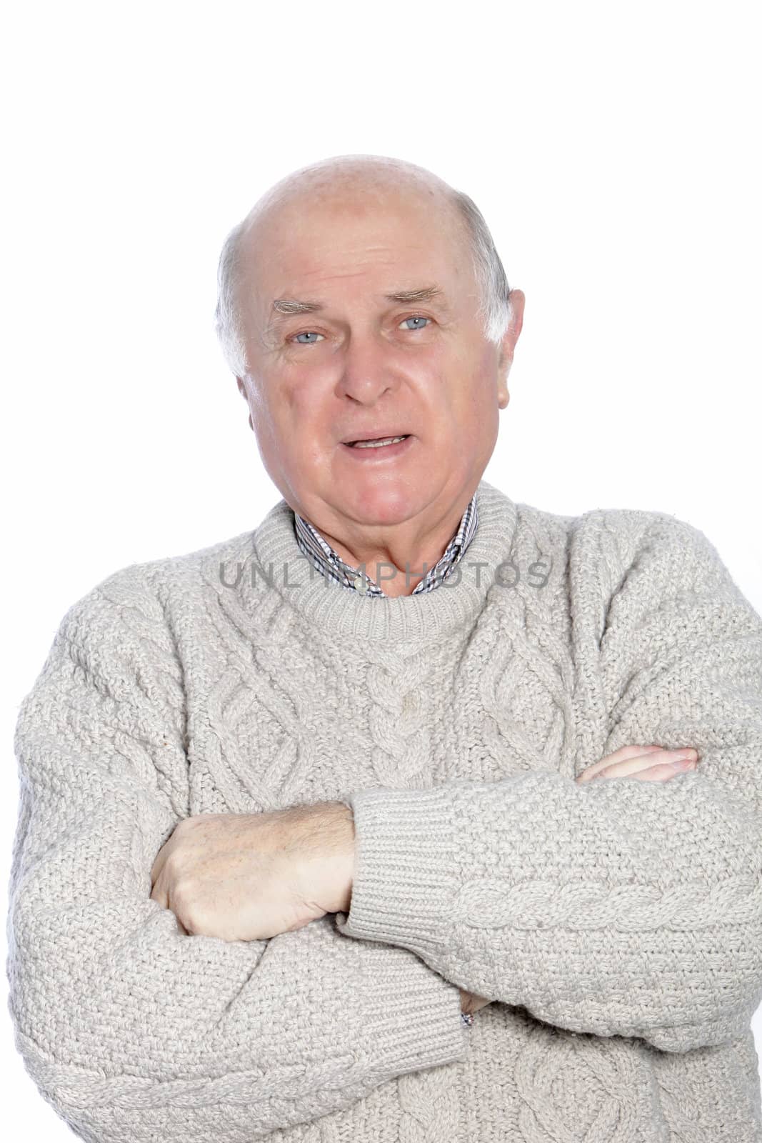 Portrait of mature, balding man, dressed in a knit, cable sweater