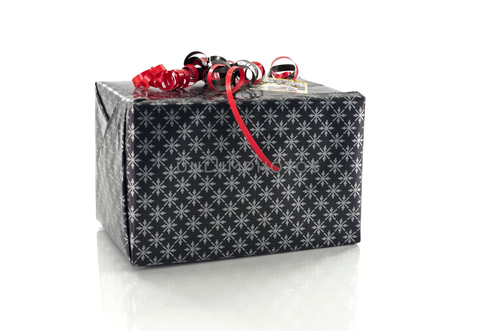 black present with red decoration on white background
