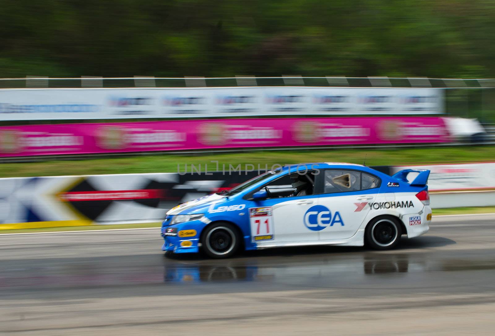 Nakhon Ratchasima, Thailand - March 9th:Unidentified car racing competitors during the "Thailand circuit 2013  " at Bonanza speedway on March 9th, 2013 in Nakhon Ratchasima, Thailand. 