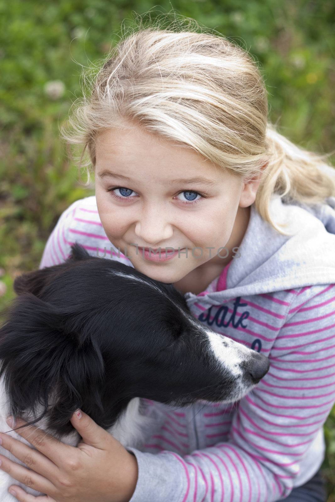 A beautiful young girl with her dog, looking at camera, Positive feeling