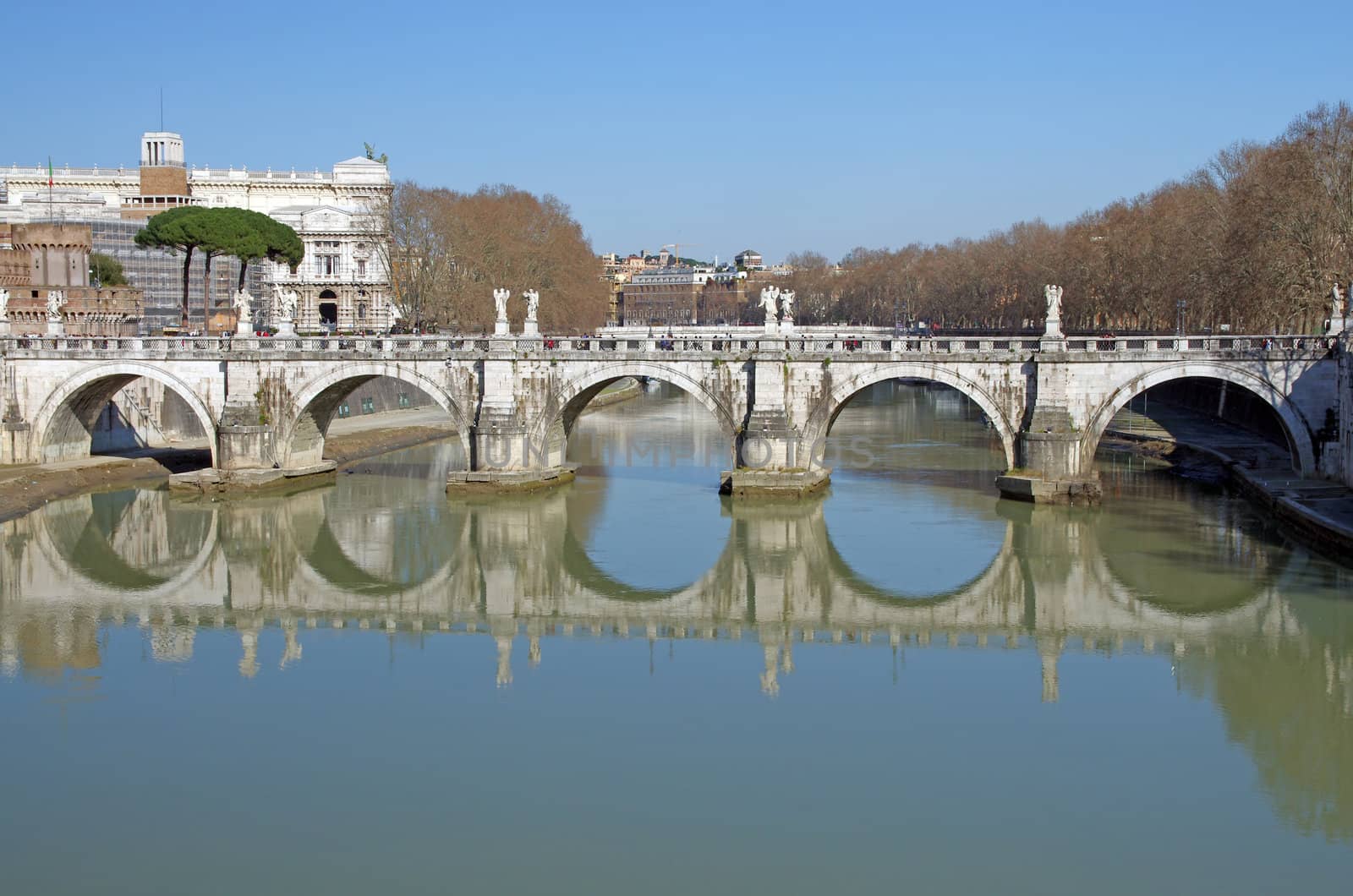 Saint Angelo bridge reflecting in Tiber river, Rome
