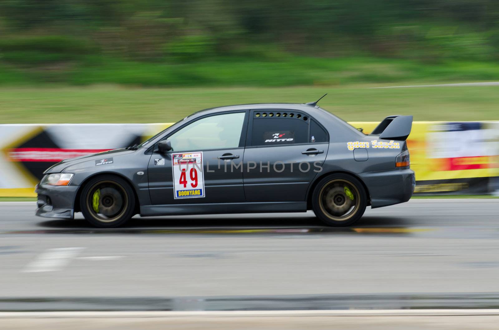 Nakhon Ratchasima, Thailand - March 9th:Unidentified car racing competitors during the "Thailand circuit 2013  " at Bonanza speedway on March 9th, 2013 in Nakhon Ratchasima, Thailand. 
